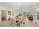 Well-lit dining area with a view of the living room and access to the kitchen at 4843 Luster Leaf Circle # 105, Myrtle Beach, SC 29577