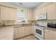 Efficient kitchen layout with white appliances and lots of counter space at 4843 Luster Leaf Circle # 105, Myrtle Beach, SC 29577