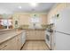 Bright kitchen featuring ample cabinet space, modern appliances, and a tile backsplash at 4843 Luster Leaf Circle # 105, Myrtle Beach, SC 29577