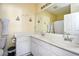 Bathroom featuring double sinks, large mirror, white cabinets, and shower at 4935 Crab Pond Ct. # 203, Myrtle Beach, SC 29579