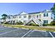 Attractive condo featuring classic white siding, green shutters and outside access at 4935 Crab Pond Ct. # 203, Myrtle Beach, SC 29579