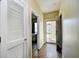 Hallway leading to bedroom with closet and door to exterior of home at 4935 Crab Pond Ct. # 203, Myrtle Beach, SC 29579