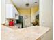 Kitchen with tan countertops, white cabinets, and stainless steel microwave at 4935 Crab Pond Ct. # 203, Myrtle Beach, SC 29579