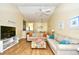 Bright living room featuring two sofas, hardwood floors, beach decor, and a vaulted ceiling with fan at 4935 Crab Pond Ct. # 203, Myrtle Beach, SC 29579