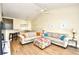 Bright living room featuring two sofas, hardwood floors, beach decor, and a vaulted ceiling with fan at 4935 Crab Pond Ct. # 203, Myrtle Beach, SC 29579