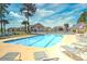 Large, sparkling pool with plenty of lounge chairs for relaxing in the sun at 4935 Crab Pond Ct. # 203, Myrtle Beach, SC 29579