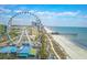 Gorgeous aerial view highlighting the ferris wheel near the beach and boardwalk attractions at 504 30Th Ave. N # 3, Myrtle Beach, SC 29577