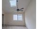 Spacious bedroom with a skylight and a ceiling fan at 504 30Th Ave. N # 3, Myrtle Beach, SC 29577