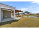 Relaxing back patio area with a pergola, ideal for outdoor dining and enjoying backyard water views at 520 Combine Dr., Conway, SC 29527