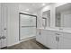 Bathroom featuring a glass-enclosed shower and dual sink vanity with white cabinets and modern fixtures at 520 Combine Dr., Conway, SC 29527