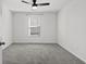 A simple bedroom with a gray carpet, and a window letting in natural light at 520 Combine Dr., Conway, SC 29527