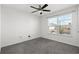 A neutral bedroom with gray carpet and a large window, creating a bright, inviting space at 520 Combine Dr., Conway, SC 29527