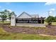 View of the Harvest Ridge community sign with landscaping and view of community homes in the background at 520 Combine Dr., Conway, SC 29527