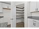 Walk-in pantry featuring wood shelving for maximum storage within a bright and easily accessible space at 520 Combine Dr., Conway, SC 29527