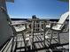 Balcony with table and chairs offering stunning views of the beach and ocean at 5511 N Ocean Blvd. # 1006, Myrtle Beach, SC 29577