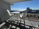 Balcony overlooking the ocean with outdoor seating, perfect for enjoying the view and fresh air at 5511 N Ocean Blvd. # 1006, Myrtle Beach, SC 29577