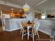 Charming dining area with a round table, four chairs, and a view of the kitchen at 5511 N Ocean Blvd. # 1006, Myrtle Beach, SC 29577