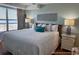 Comfortable bedroom with a serene ocean view at 5511 N Ocean Blvd. # 1006, Myrtle Beach, SC 29577