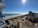 Breathtaking ocean views from a high-rise balcony, showcasing the coastline and surrounding cityscape at 5511 N Ocean Blvd. # 1006, Myrtle Beach, SC 29577