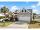 Charming one-story home with brick facade, two-car garage, and well-manicured landscaping at 5719 Whistling Duck Dr., North Myrtle Beach, SC 29582