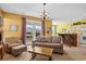 Bright living room with French doors leading to a patio, complemented by comfortable seating at 5719 Whistling Duck Dr., North Myrtle Beach, SC 29582