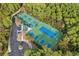 Community tennis courts, pickle ball courts, and a parking lot with many trees at 5719 Whistling Duck Dr., North Myrtle Beach, SC 29582