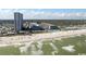 An aerial view showing a large resort complex situated on a vast sandy beach with ocean views at 5907 S Kings Hwy. # 1409, Myrtle Beach, SC 29575