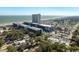 An aerial view of a beachfront resort featuring a large complex, pool, and easy beach access at 5907 S Kings Hwy. # 1409, Myrtle Beach, SC 29575