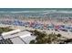 A crowded beach features colorful umbrellas and sunbathers enjoying the ocean view from the condo at 5907 S Kings Hwy. # 1409, Myrtle Beach, SC 29575