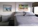 Serene bedroom with comfortable bed, stylish side table, and calming artwork at 5907 S Kings Hwy. # 1409, Myrtle Beach, SC 29575