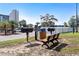 Outdoor grilling area with multiple grills, seating, and a nearby parking area at 5907 S Kings Hwy. # 1409, Myrtle Beach, SC 29575