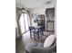 Inviting living space featuring a cozy armchair, dining area, and modern kitchen with stainless steel appliances at 5907 S Kings Hwy. # 1409, Myrtle Beach, SC 29575