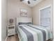 Cozy bedroom featuring a striped quilt, side table, and decor to enhance the appeal of the property at 6001-1723 South Kings Hwy., Myrtle Beach, SC 29575