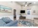 Cozy living room with beachy decor, neutral walls, ceiling fan and comfortable seating arrangement at 6001-1723 South Kings Hwy., Myrtle Beach, SC 29575