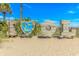 Ocean Lakes sign displaying I (Heart) OL on a sandy beach with beautiful landscaping and a clear blue sky at 6001-1723 South Kings Hwy., Myrtle Beach, SC 29575