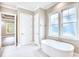 Bright bathroom featuring a soaking tub and two large, sunny windows at 641 Waterbridge Blvd., Myrtle Beach, SC 29579