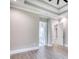 Spacious bedroom featuring a tray ceiling, and doorways to a bathroom and another room at 641 Waterbridge Blvd., Myrtle Beach, SC 29579