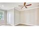 Cozy bedroom with a ceiling fan, hardwood floors, window and white trim at 641 Waterbridge Blvd., Myrtle Beach, SC 29579