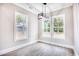 Charming dining area with two windows offering scenic views and a modern light fixture at 641 Waterbridge Blvd., Myrtle Beach, SC 29579