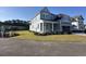 Beautiful two-story home with a well-manicured lawn, lush landscaping, and a paved driveway at 641 Waterbridge Blvd., Myrtle Beach, SC 29579