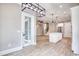 Bright, open kitchen features white cabinets, a central island, and modern pendant lighting at 641 Waterbridge Blvd., Myrtle Beach, SC 29579