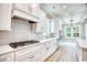 Bright kitchen featuring white cabinetry, stainless steel appliances, and a modern subway tile backsplash at 641 Waterbridge Blvd., Myrtle Beach, SC 29579