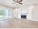 Living room with sliding glass doors, hardwood floors, built-in bookshelves and a modern fireplace at 641 Waterbridge Blvd., Myrtle Beach, SC 29579