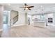 Open-concept living room with hardwood floors flows seamlessly into a modern kitchen with stainless steel appliances at 641 Waterbridge Blvd., Myrtle Beach, SC 29579