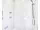 Modern shower features marble tile, built-in shelves, and bronze hardware at 641 Waterbridge Blvd., Myrtle Beach, SC 29579