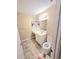 Functional bathroom featuring a vanity with a sink, a large mirror, and neutral tile flooring at 6512 Laguna Point, Myrtle Beach, SC 29588