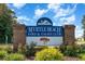 Myrtle Beach Golf & Yacht Club signage with brick surround and colorful landscaping at 6512 Laguna Point, Myrtle Beach, SC 29588