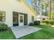 Exterior view of a home featuring a screened in porch area with a concrete patio at 6512 Laguna Point, Myrtle Beach, SC 29588