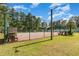 Exterior shot of fenced in community tennis court on a sunny day at 6512 Laguna Point, Myrtle Beach, SC 29588