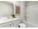 Clean bathroom with a shower/tub combo, modern vanity, toilet and decorative framed art at 692 Wallace Dr., Little River, SC 29566